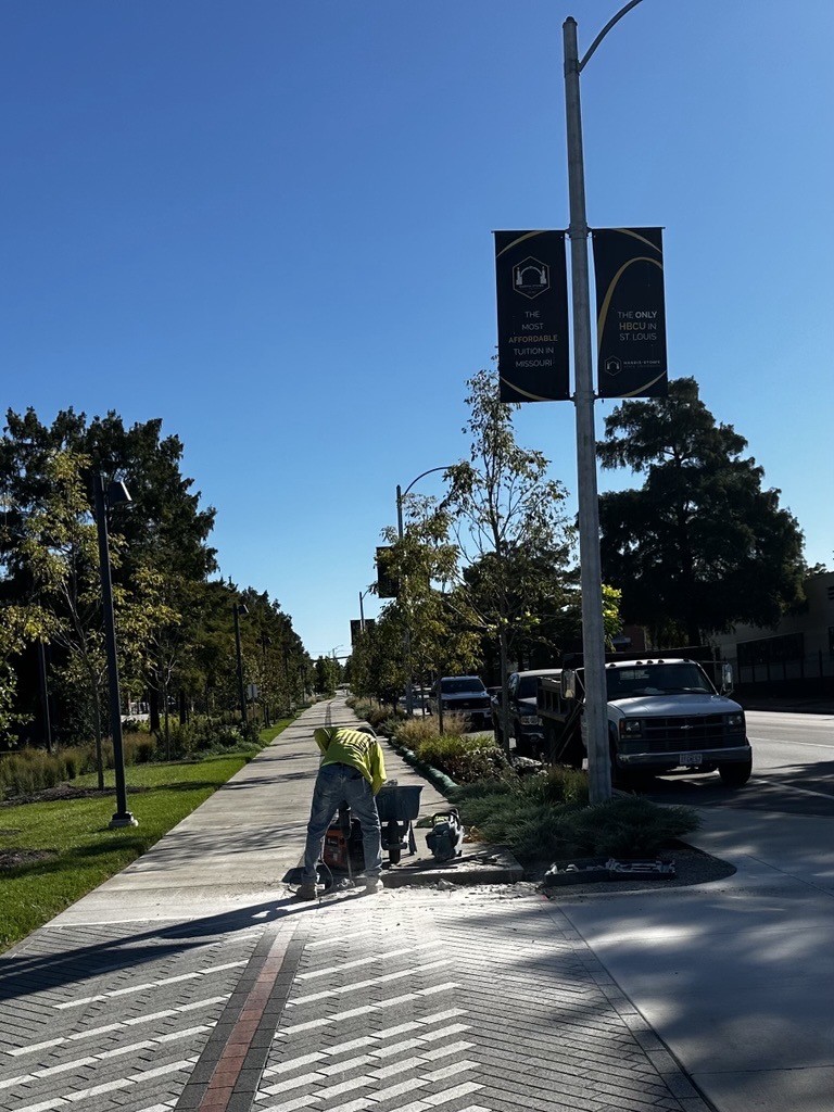 Construction worker completing concrete work on Brickline Greenway near Compton Ave