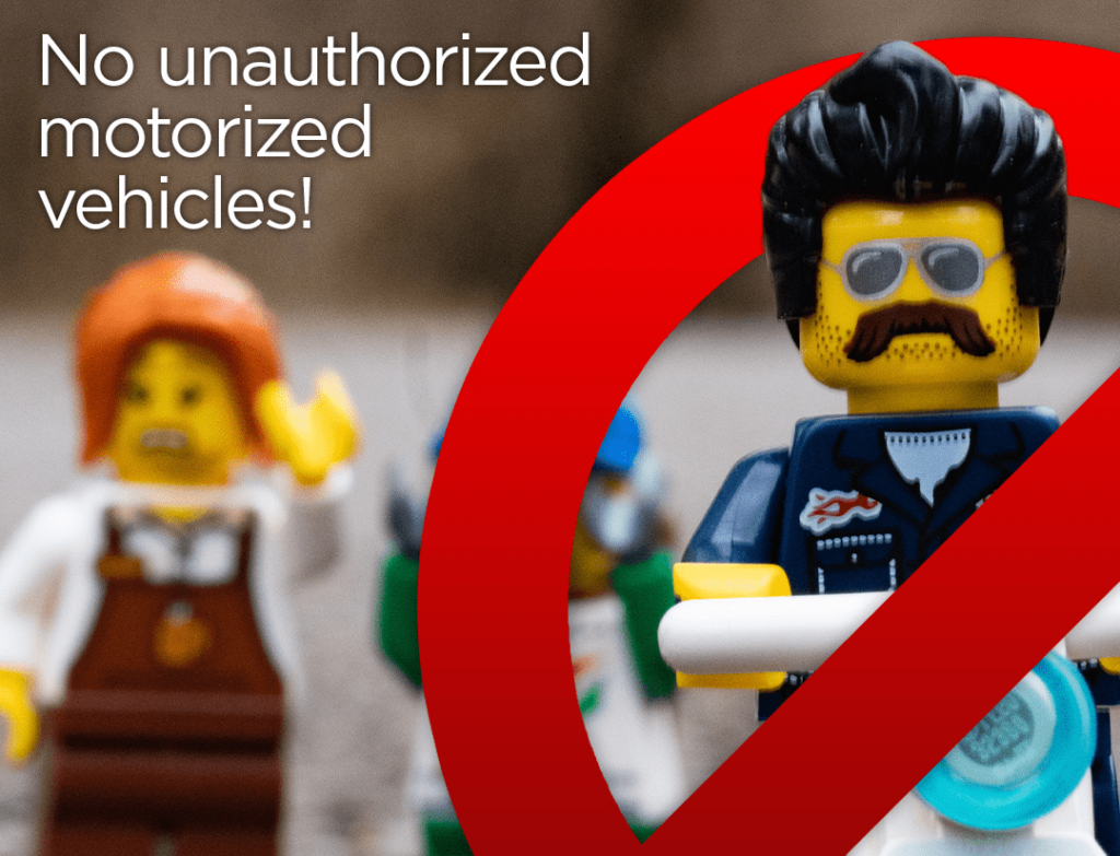 Lego figures with the text: "No unauthorized motorized vehicles!"