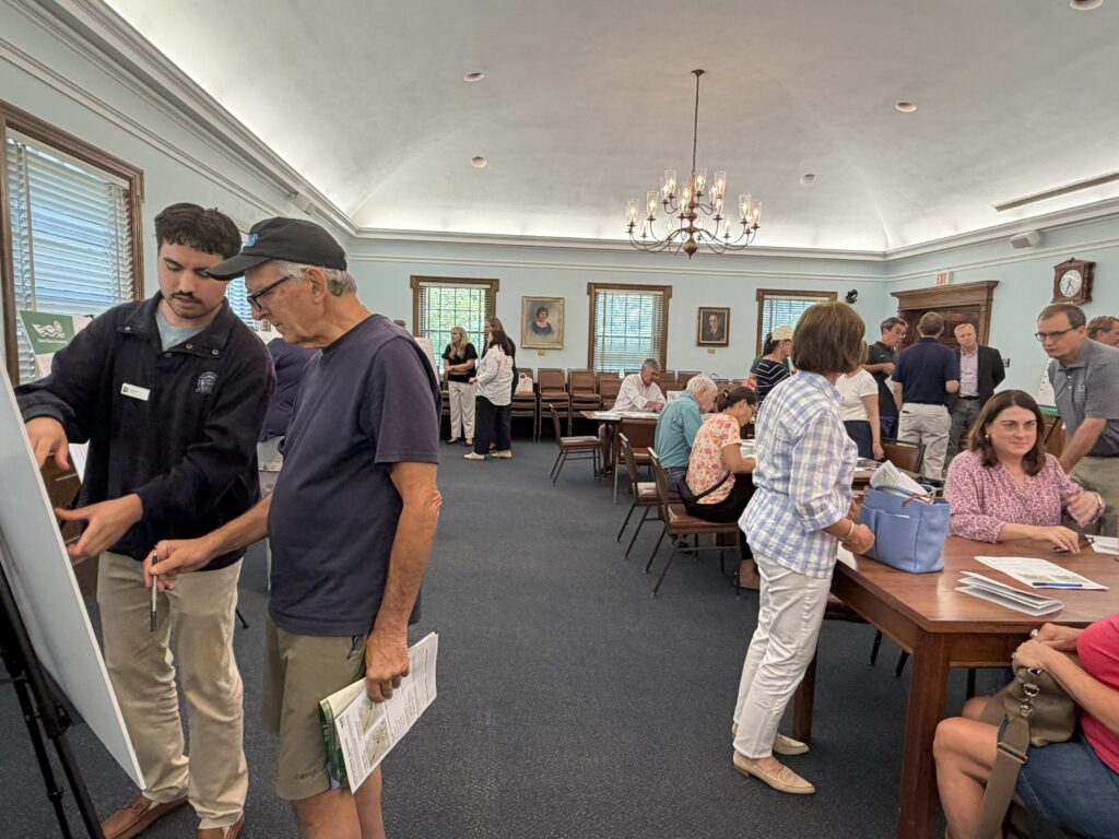 Community members talking at the Brentwood to Tilles Park June open house