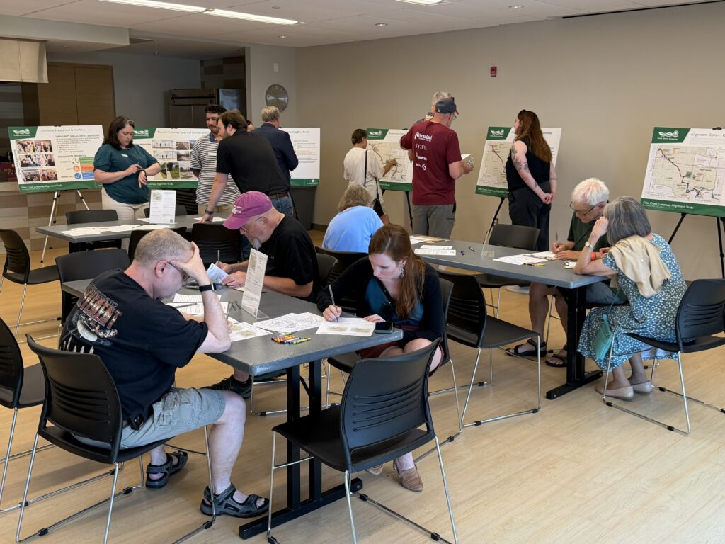 Community members talking at the Brentwood to Tilles Park June open house
